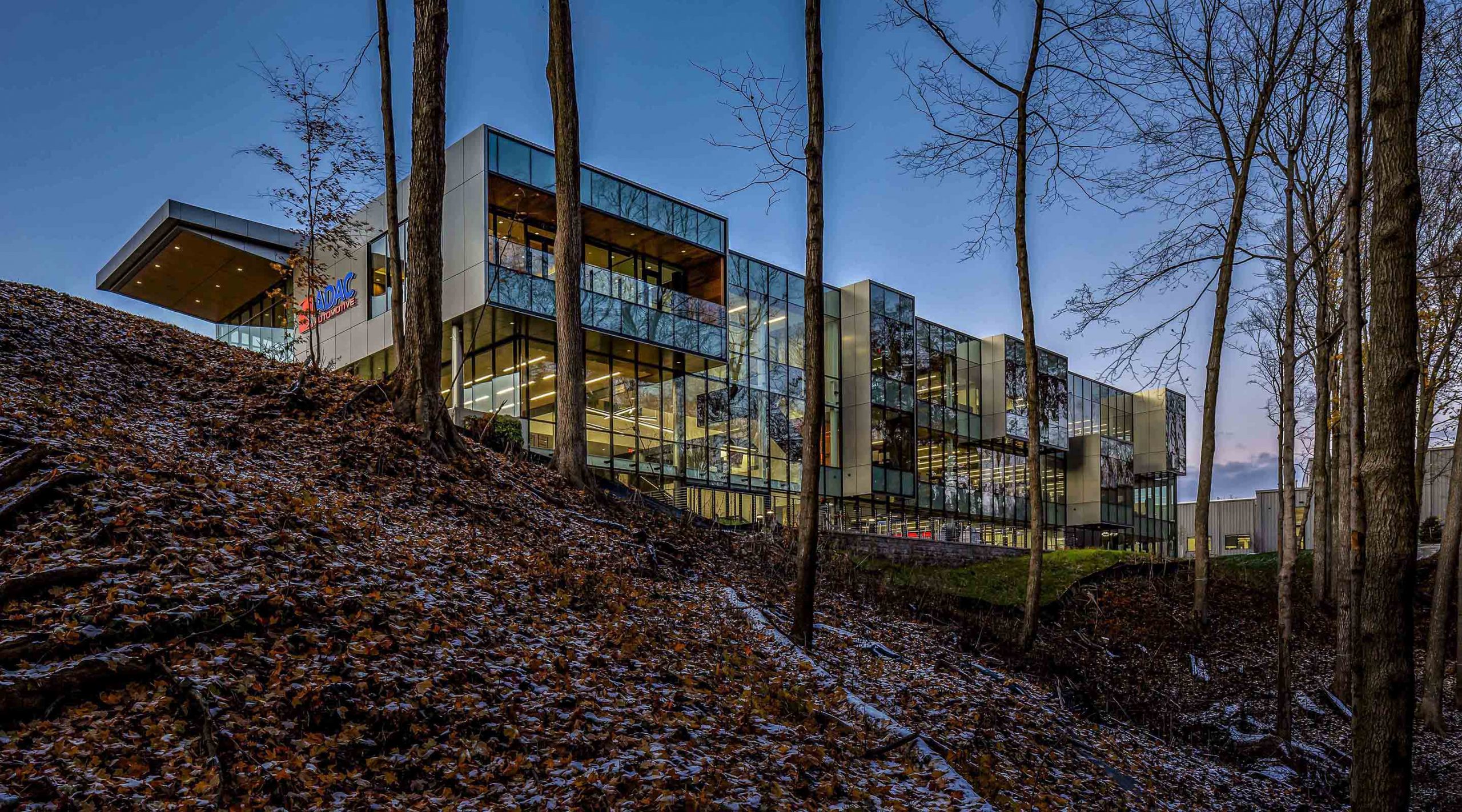2378-H- Site Selection Leads to Transformative Results. The naturally wooded ravine, dynamic site views, and regional connectivity were strong determining factors in the ADAC’s commitment to West Michigan to select this site. The company’s vision to create a workplace environment that fosters health & wellness, creativity, innovation, and opportunity for its employees is being realized and seeing transformative results.